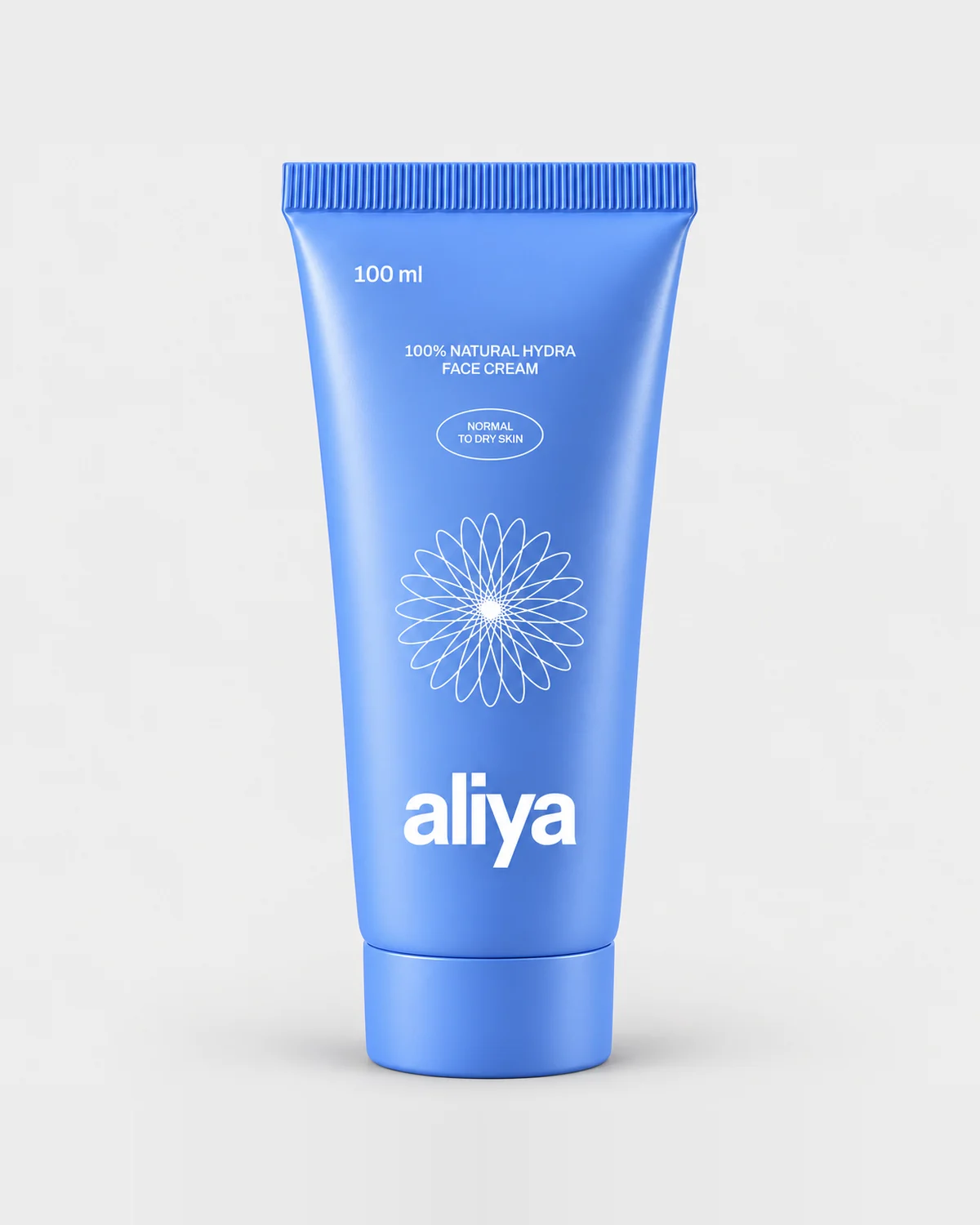 Aliya hydra face cream, 100 ml blue tube, on a pale grey backdrop